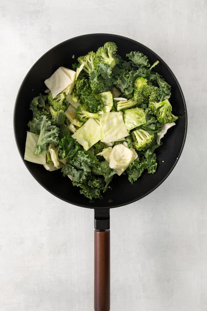 Cabbage, broccoli, and kale in a wok