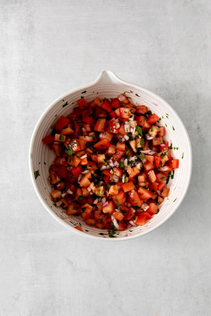 Pico de gallo ingredients mixed in a bowl