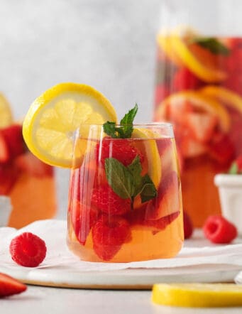 Glasses and a pitcher of sangria are shown.