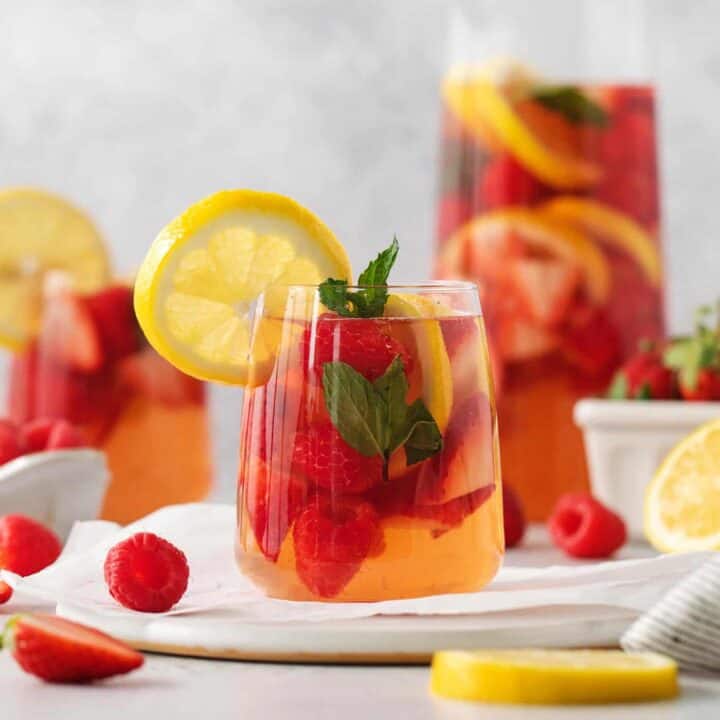Glasses and a pitcher of sangria are shown.