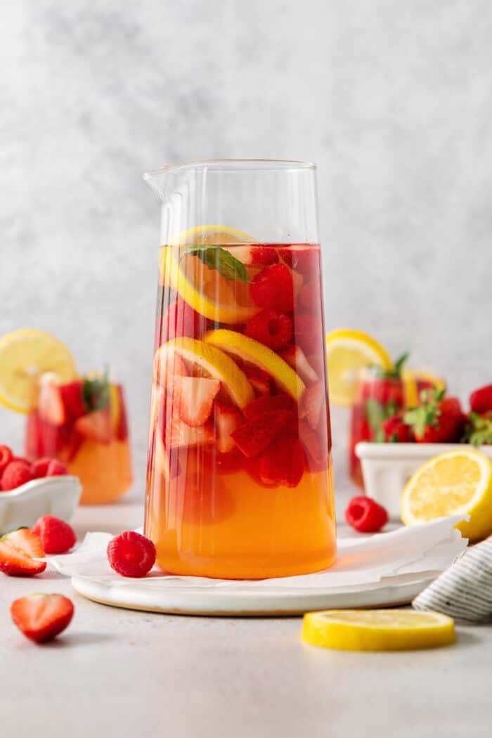 A pitcher of sangria and fruit.