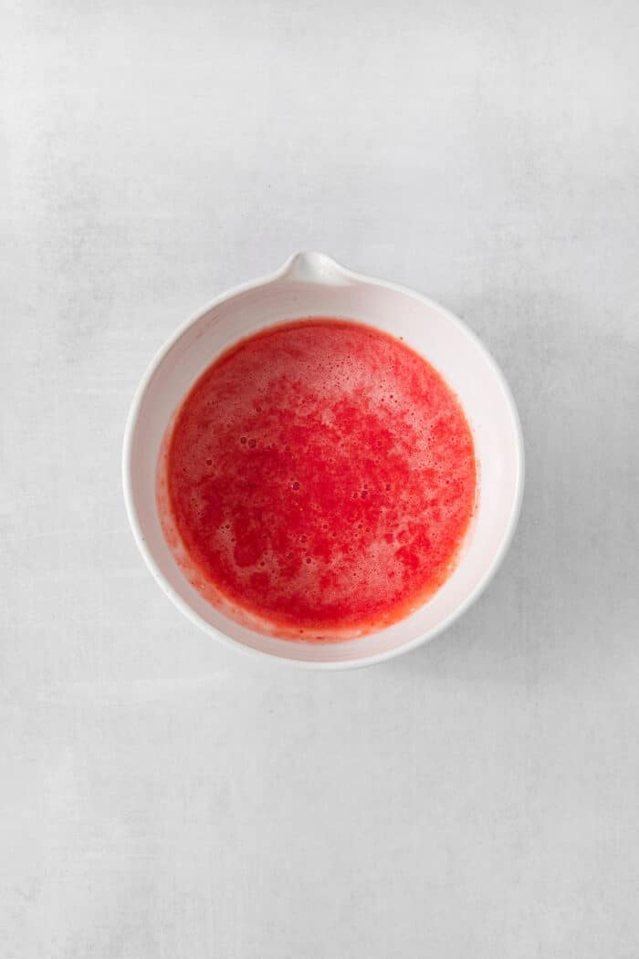 Pureed strawberries are shown in a white bowl.