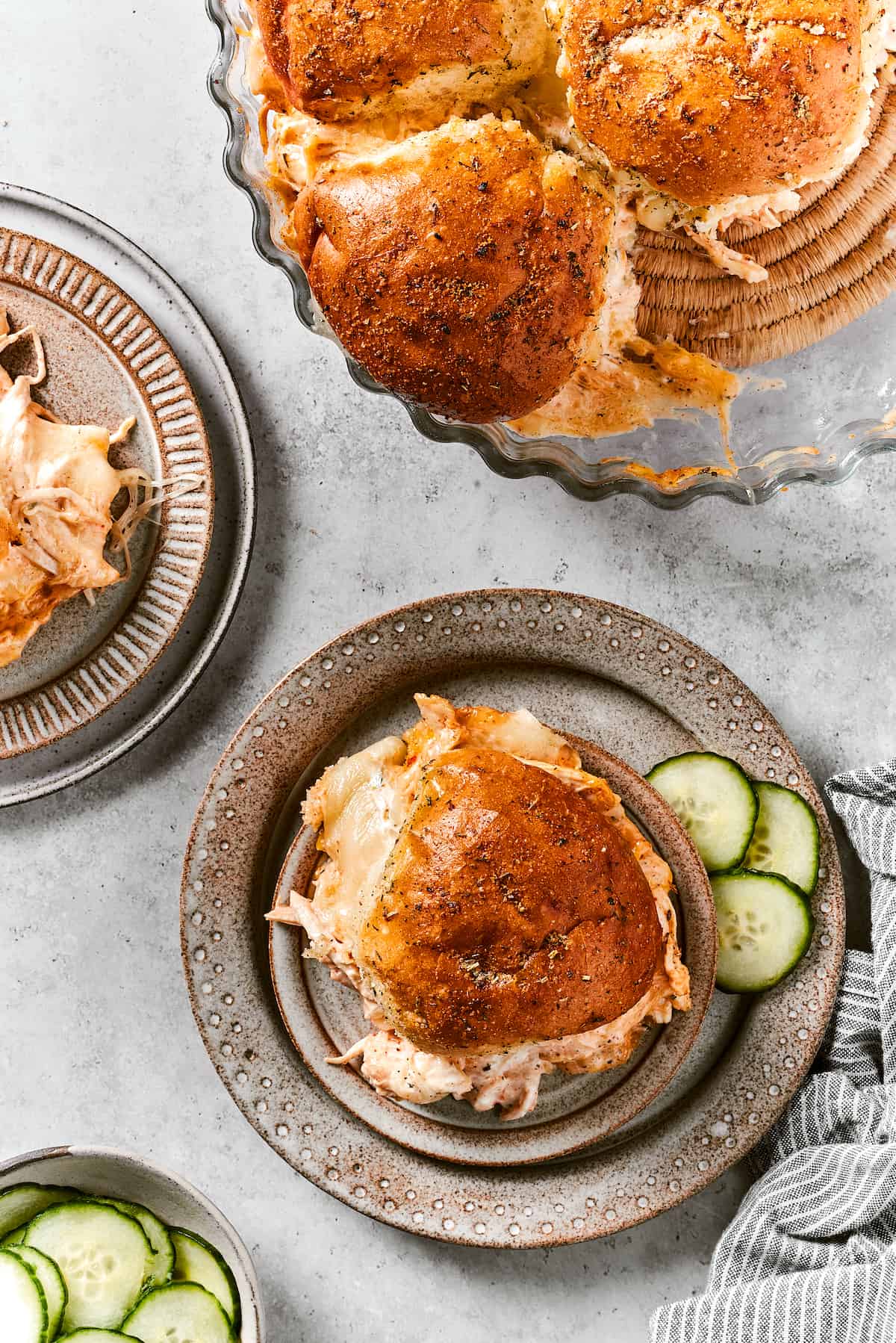 Buffalo chicken sliders are shown on plates.