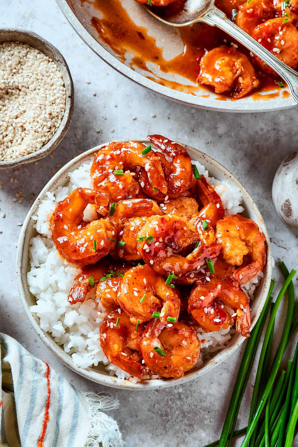 Overhead view of a bowl of firecracker shrimp with rice