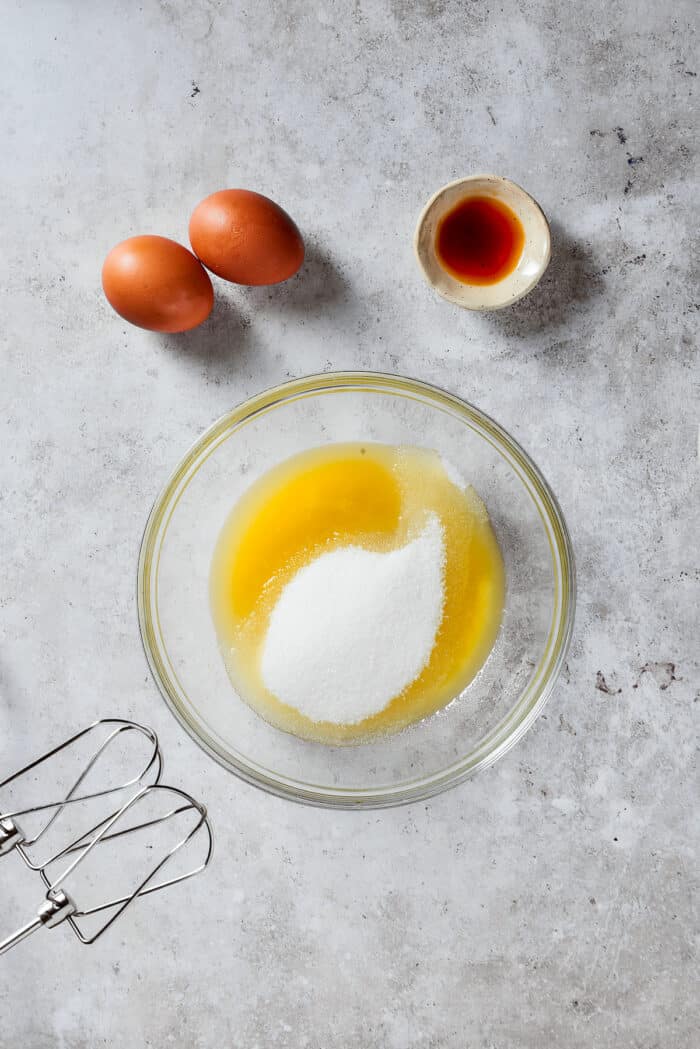 Mixing the sugar and butter together.