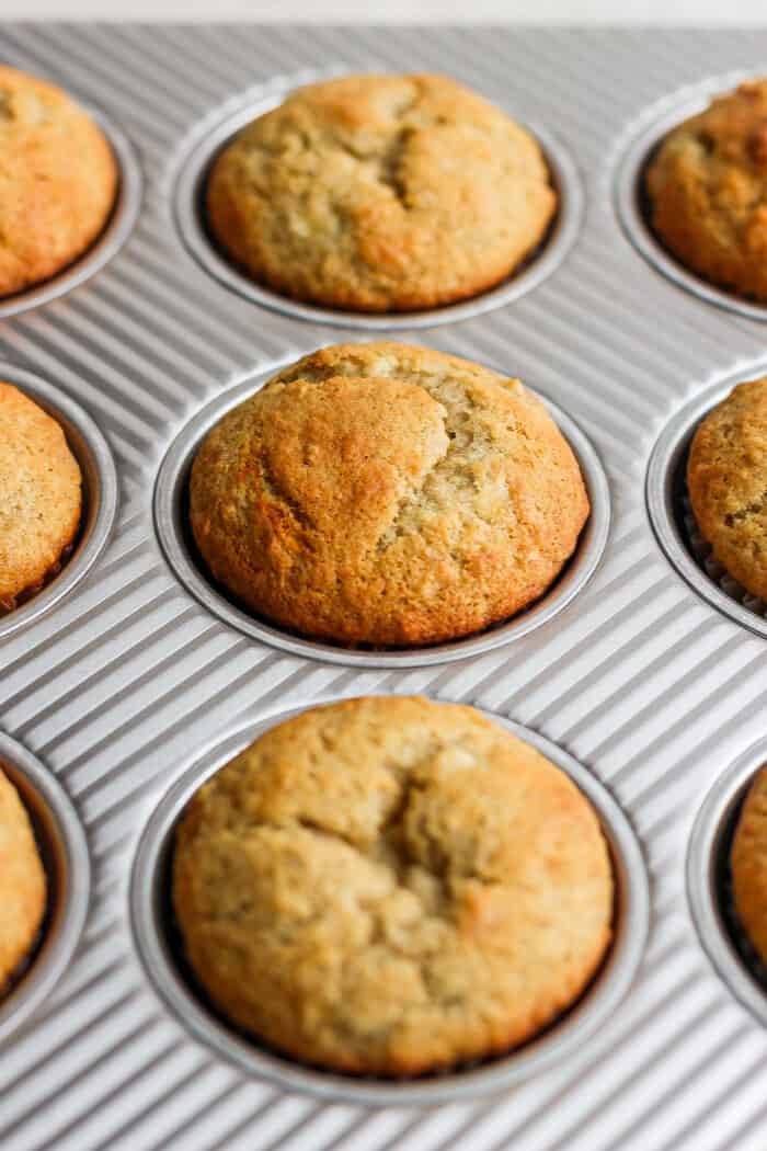 baked banana muffins in a muffin tin