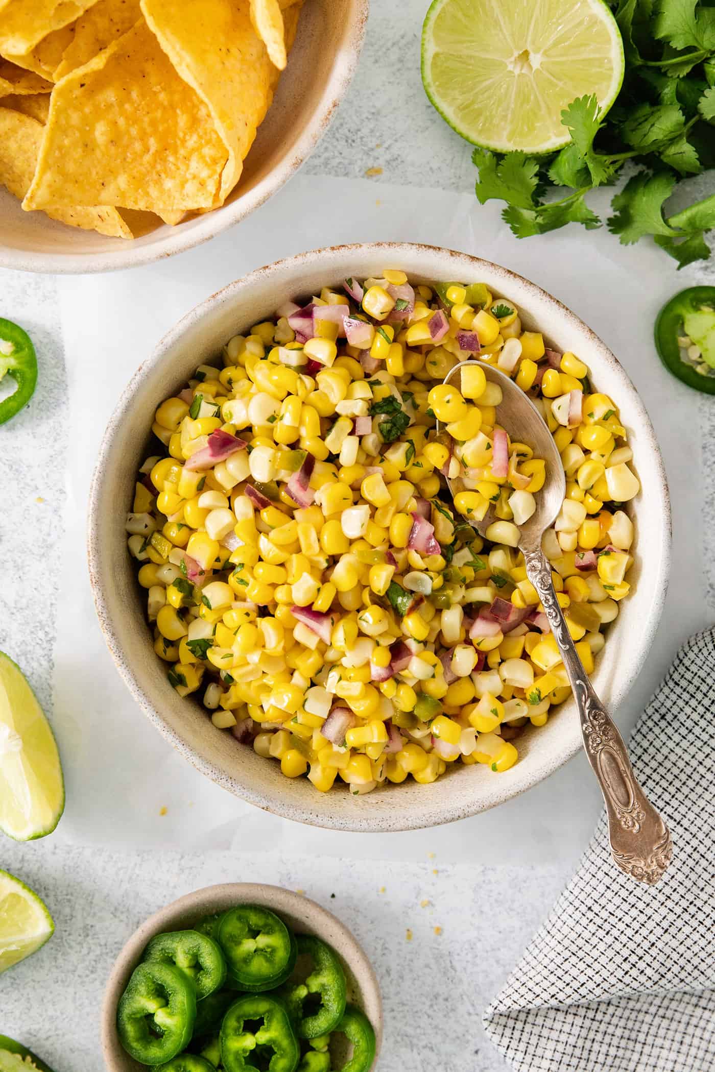 Chipotle chili corn salsa in a bowl with a spoon