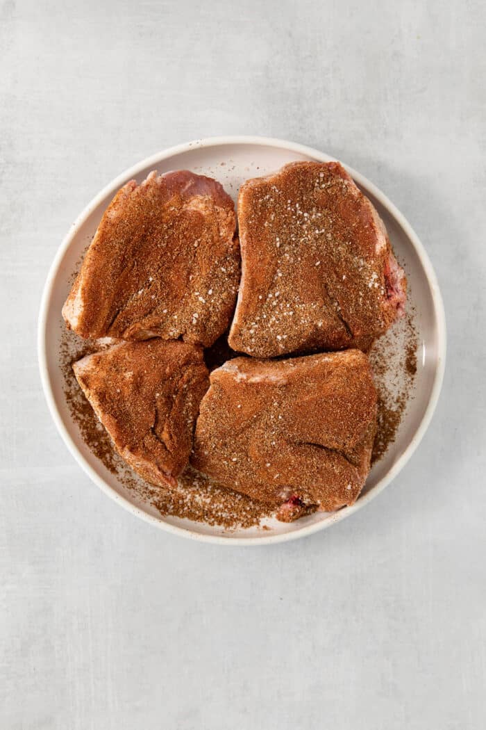 Pork is seasoned.
