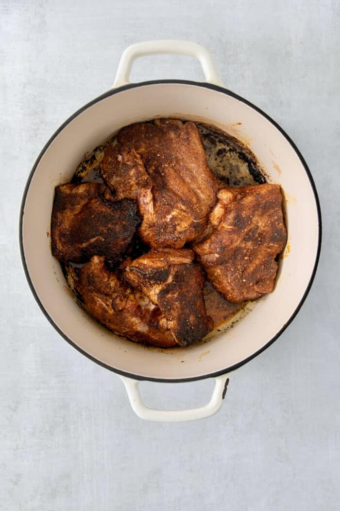 Cooked pork in a dutch oven.