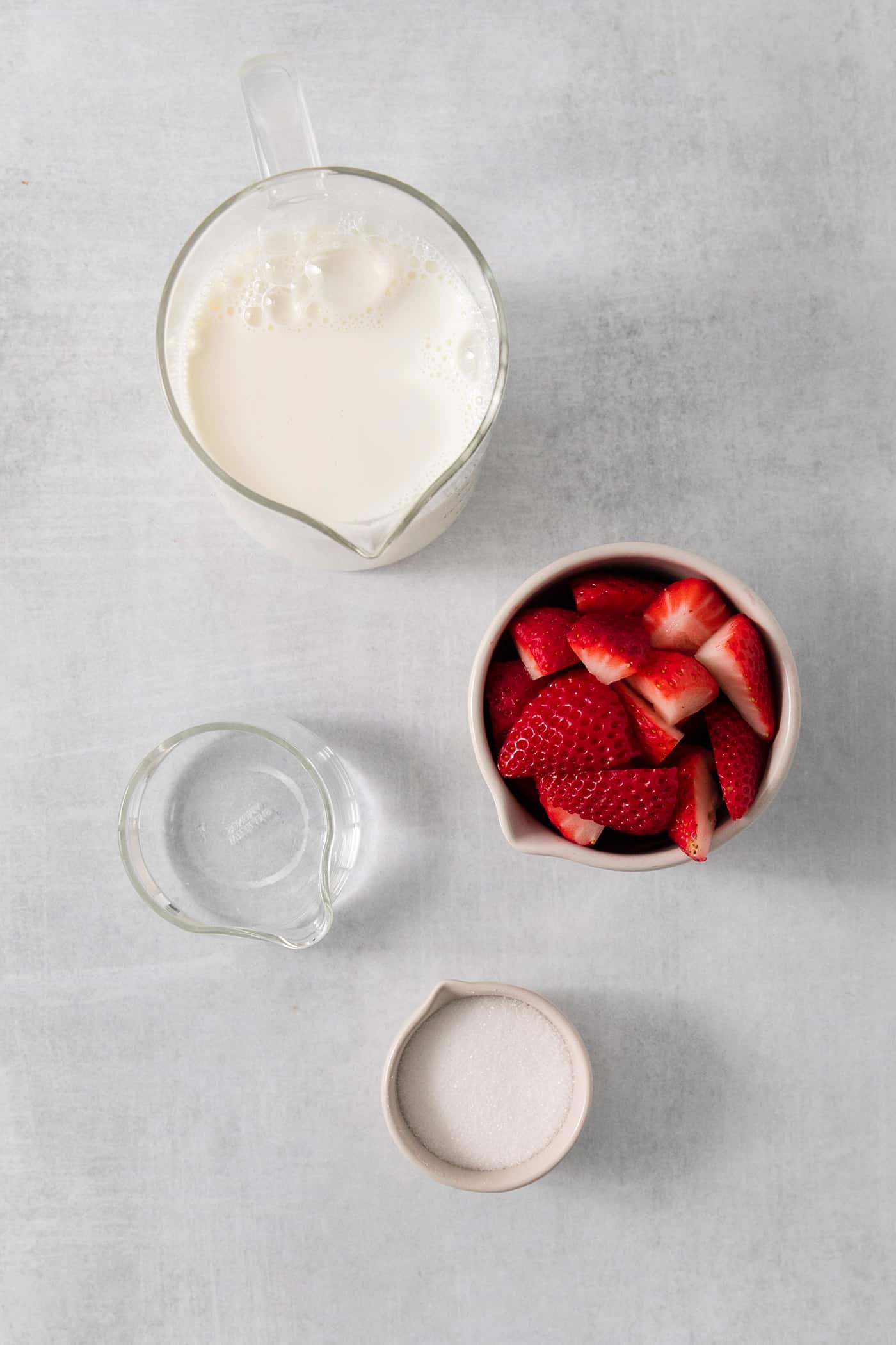 Ingredients for strawberry milk include water, milk, strawberries, and sugar.