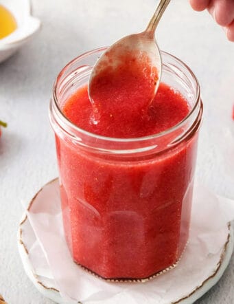 a spoon of strawberry sauce