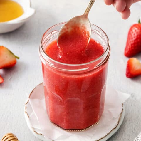 a spoon of strawberry sauce