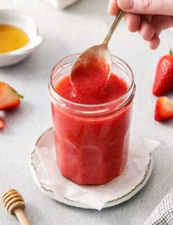 a spoon of strawberry sauce