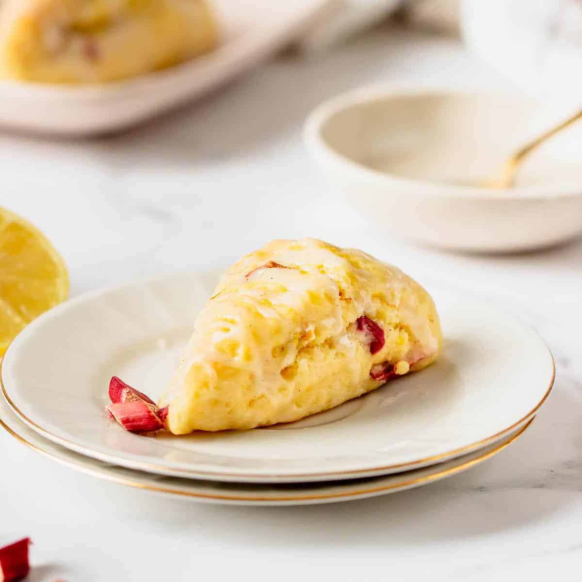 a scone with lemon and rhubarb on a plate