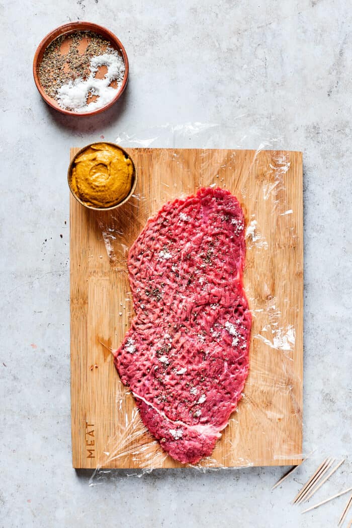 Prepping a beef strip.