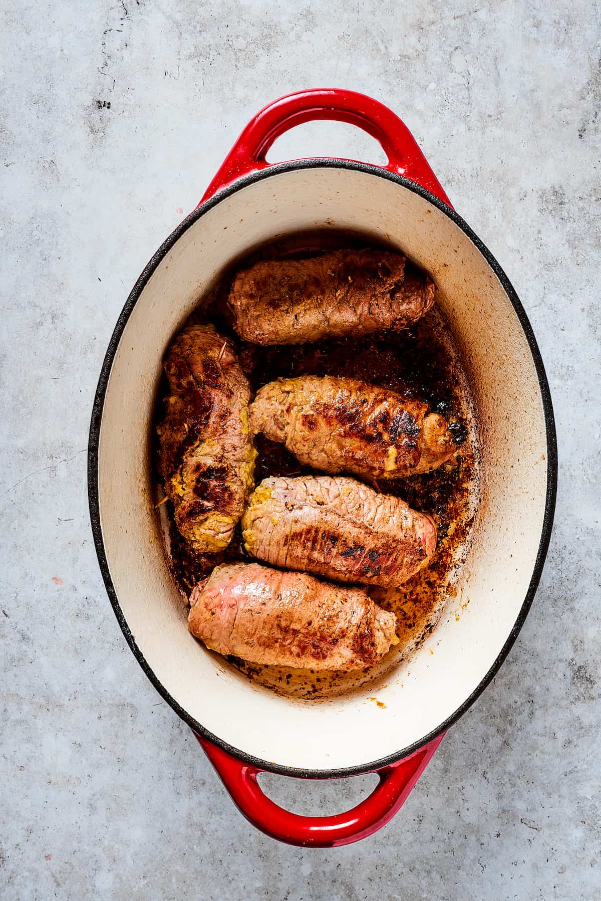 Beef rolls in a dutch oven.