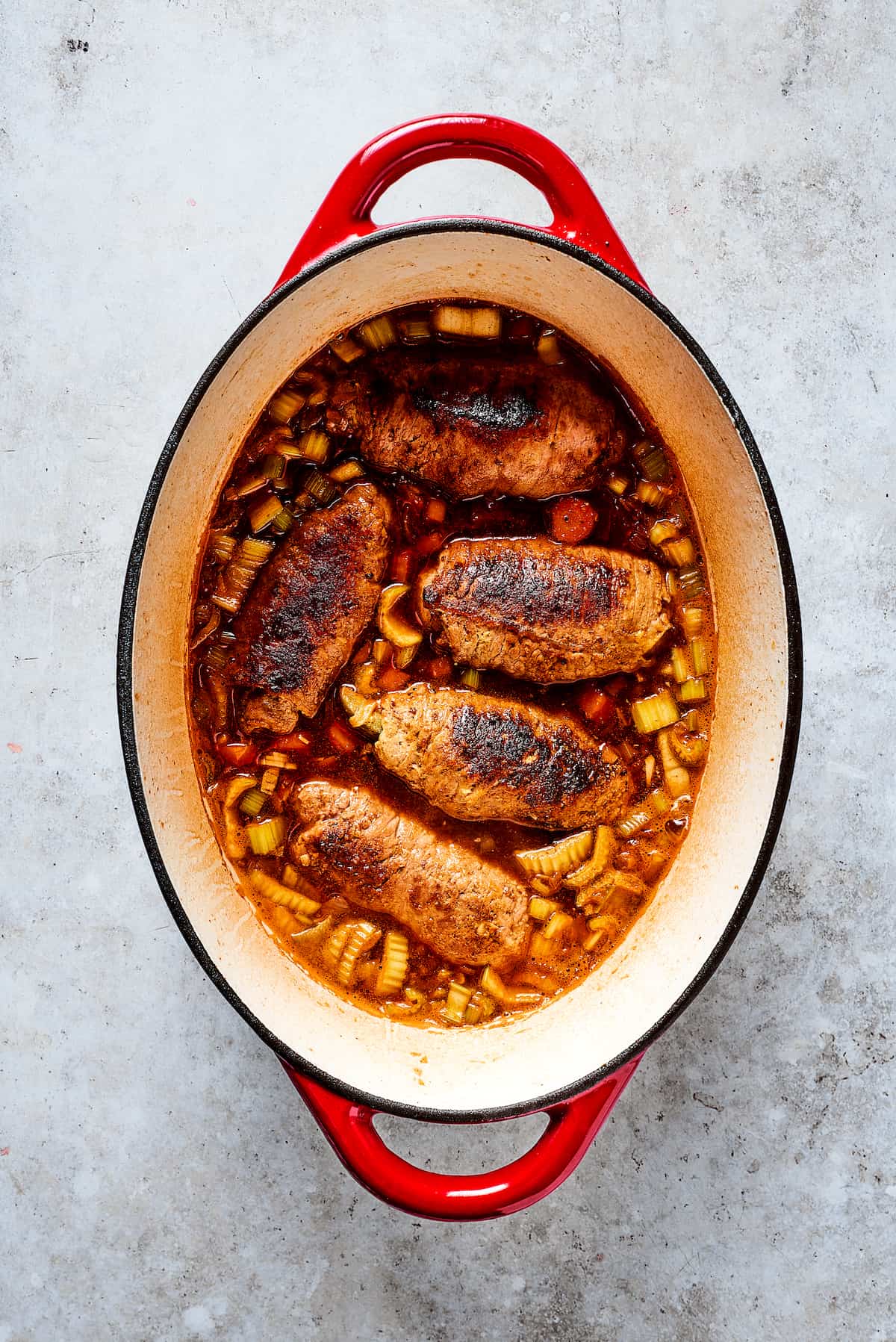 Browning rouladen in a dutch oven.