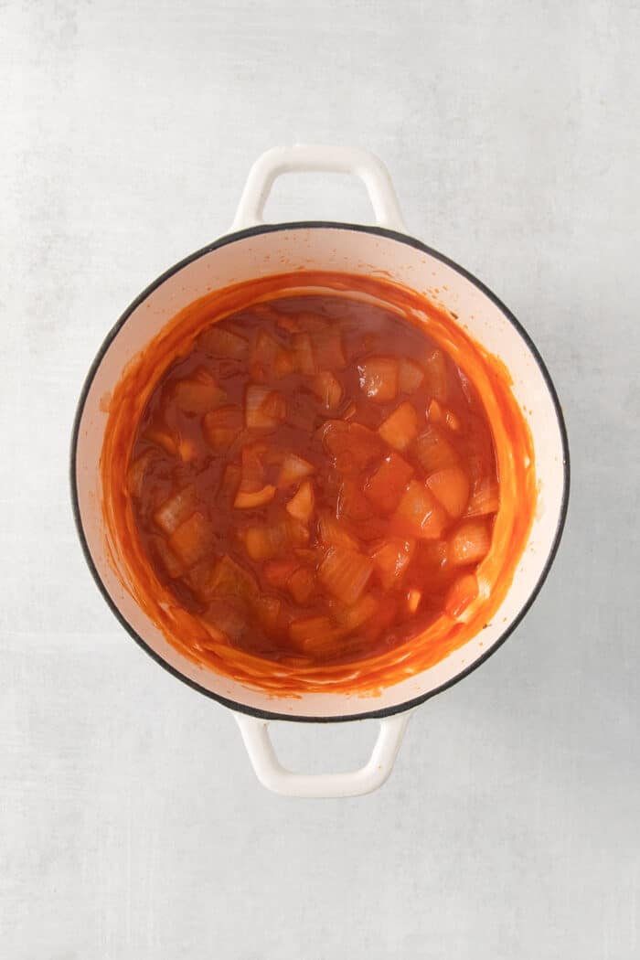 barbecue sauce cooking in a white pot