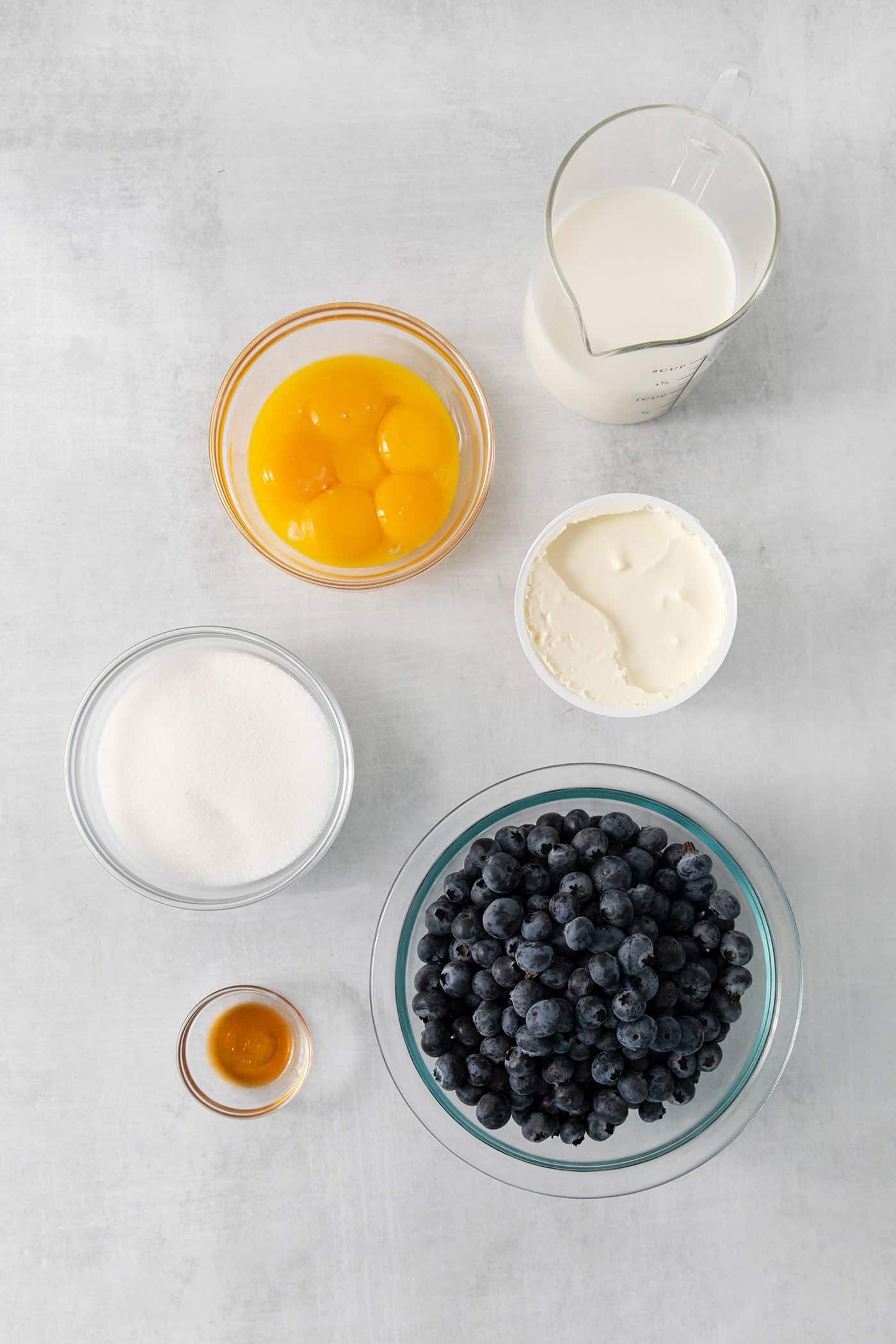 Ingredients needed to make crème fraîche blueberry ice cream.