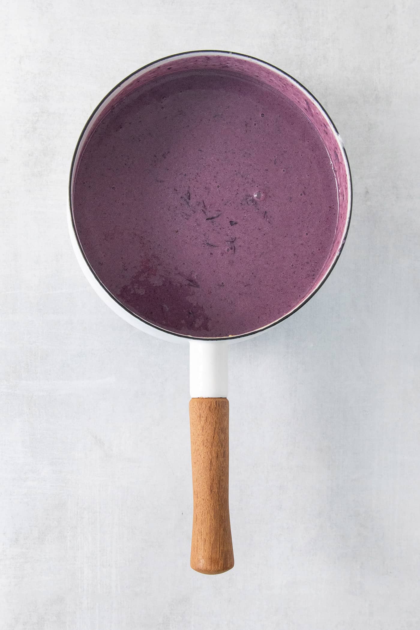 Blueberry puree in a pot.