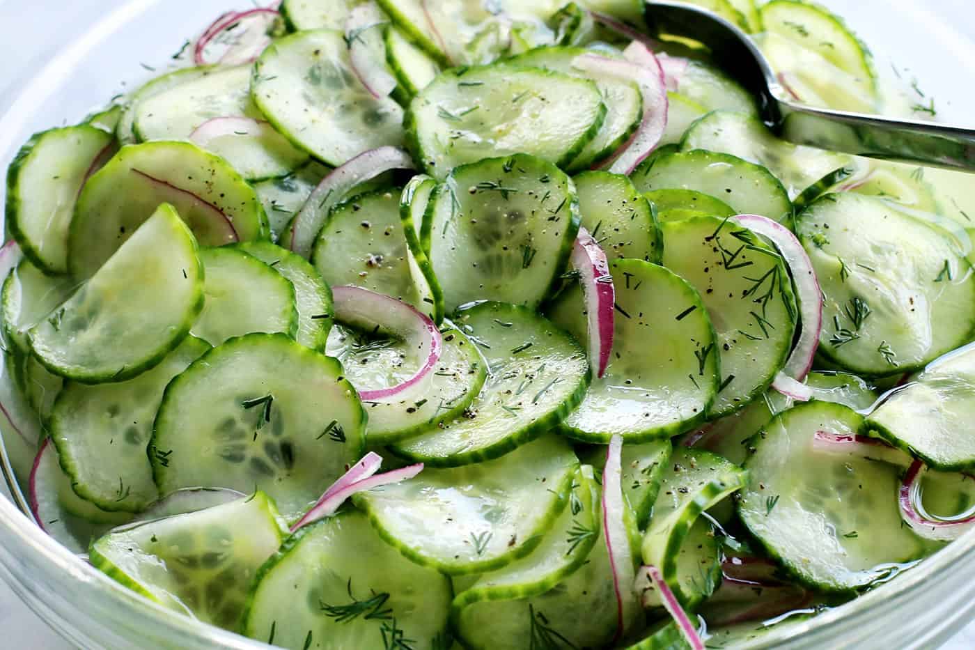 close up photo of cucumber salad in a bowl