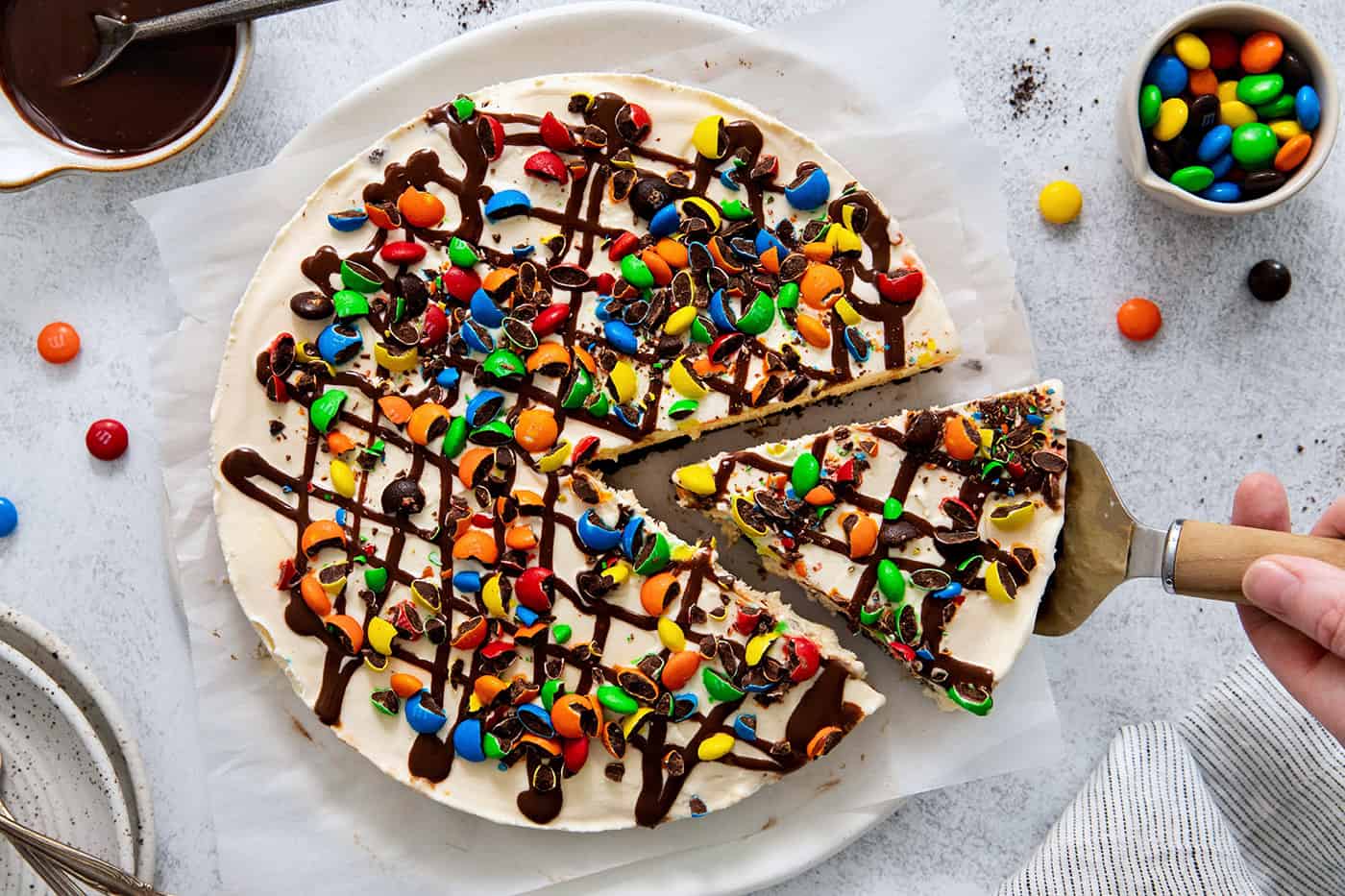 A slice of ice cream pizza being served