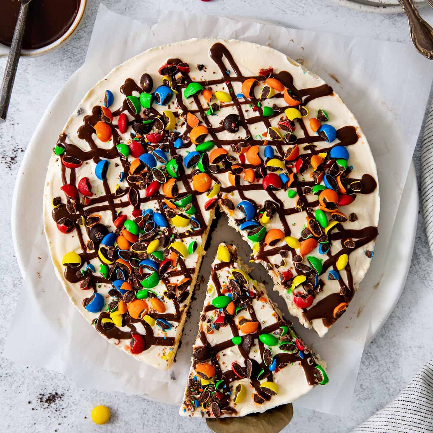 Overhead view of a slice of ice cream pizza being served