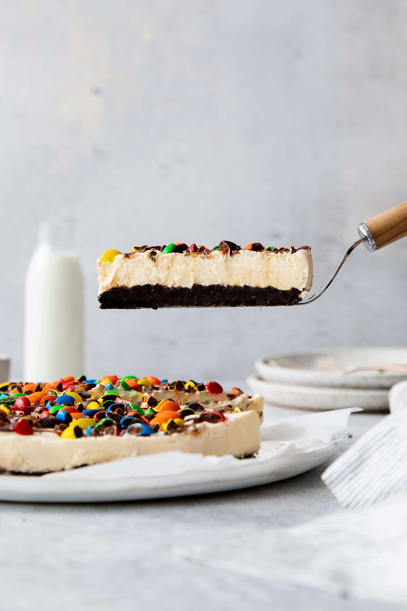 A slice of ice cream pizza on a serving spatula