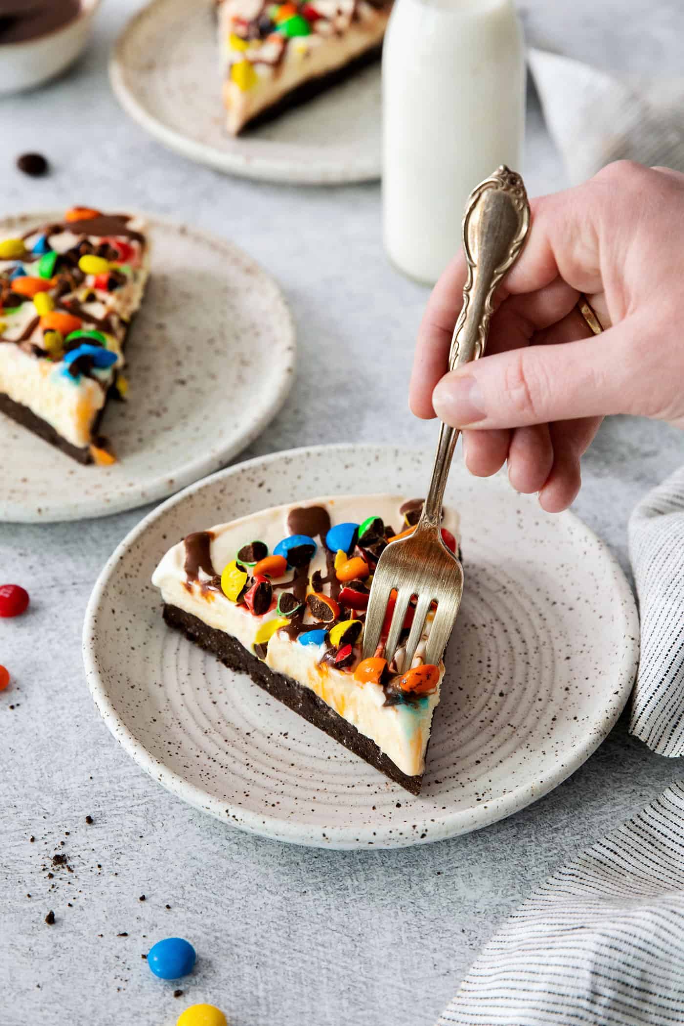 A fork diving into a slice of homemade ice cream pizza