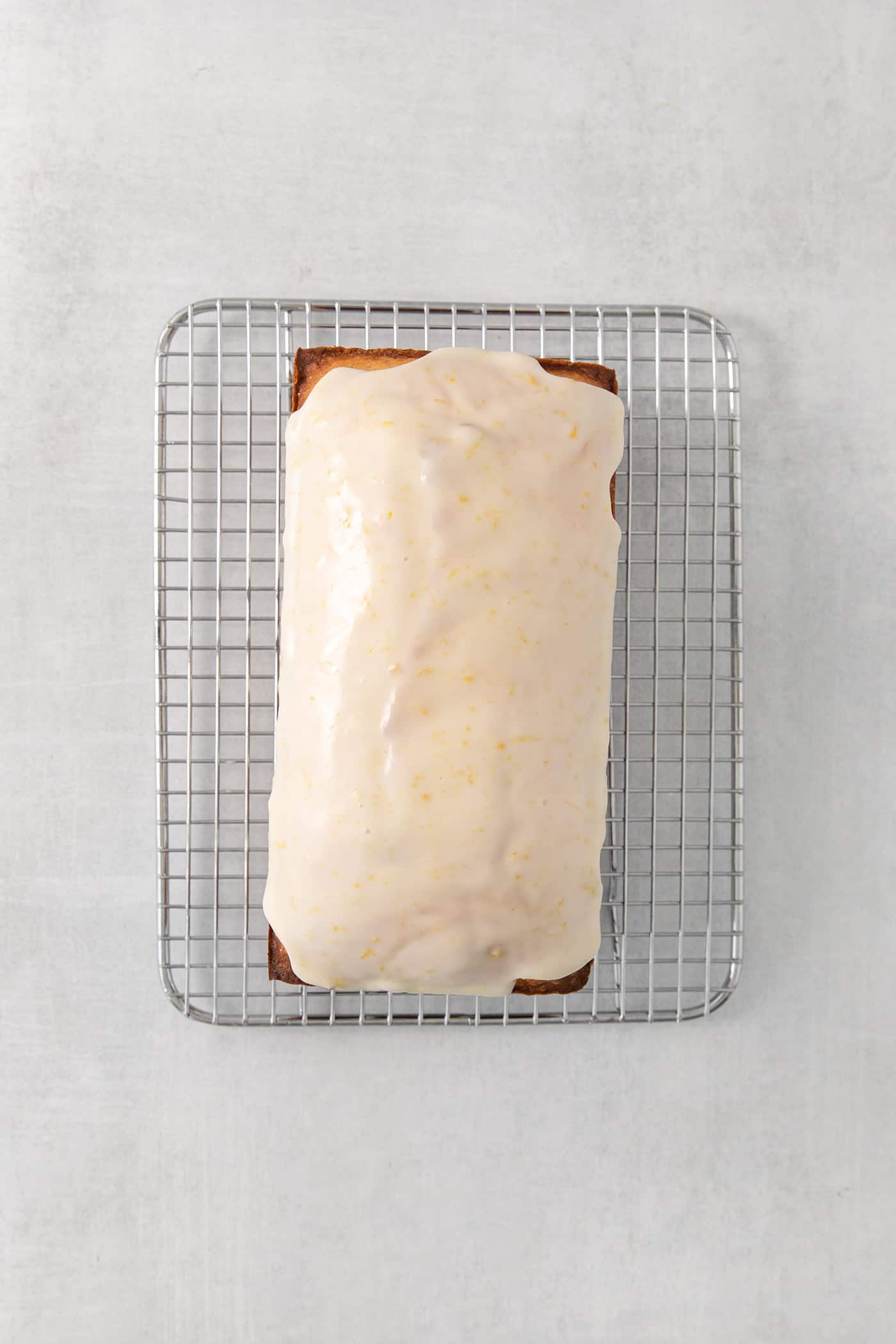 A lemon pound cake topped with lemon glaze.