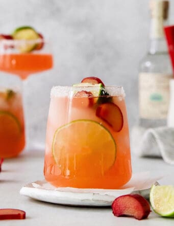 a glass of margarita cocktail made with rhubarb syrup