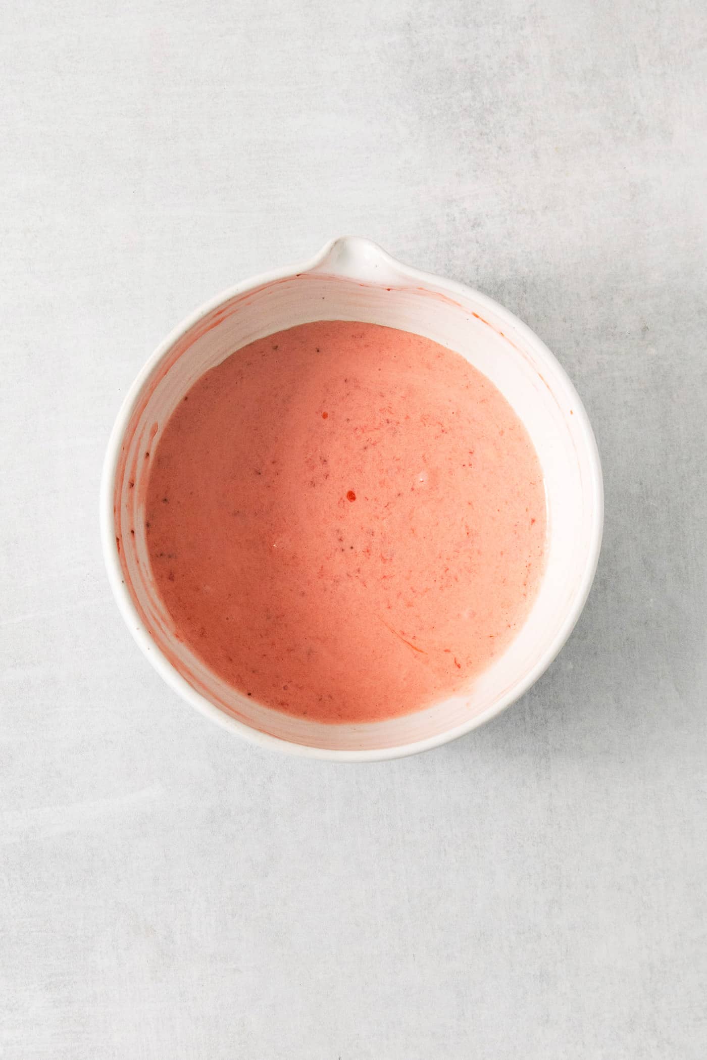 A bowl of strawberry puree.