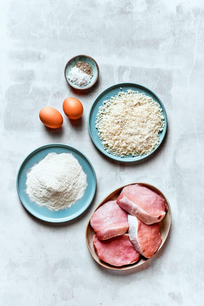 Ingredients for pork katsu - eggs, pork, breadcrumbs, flour.