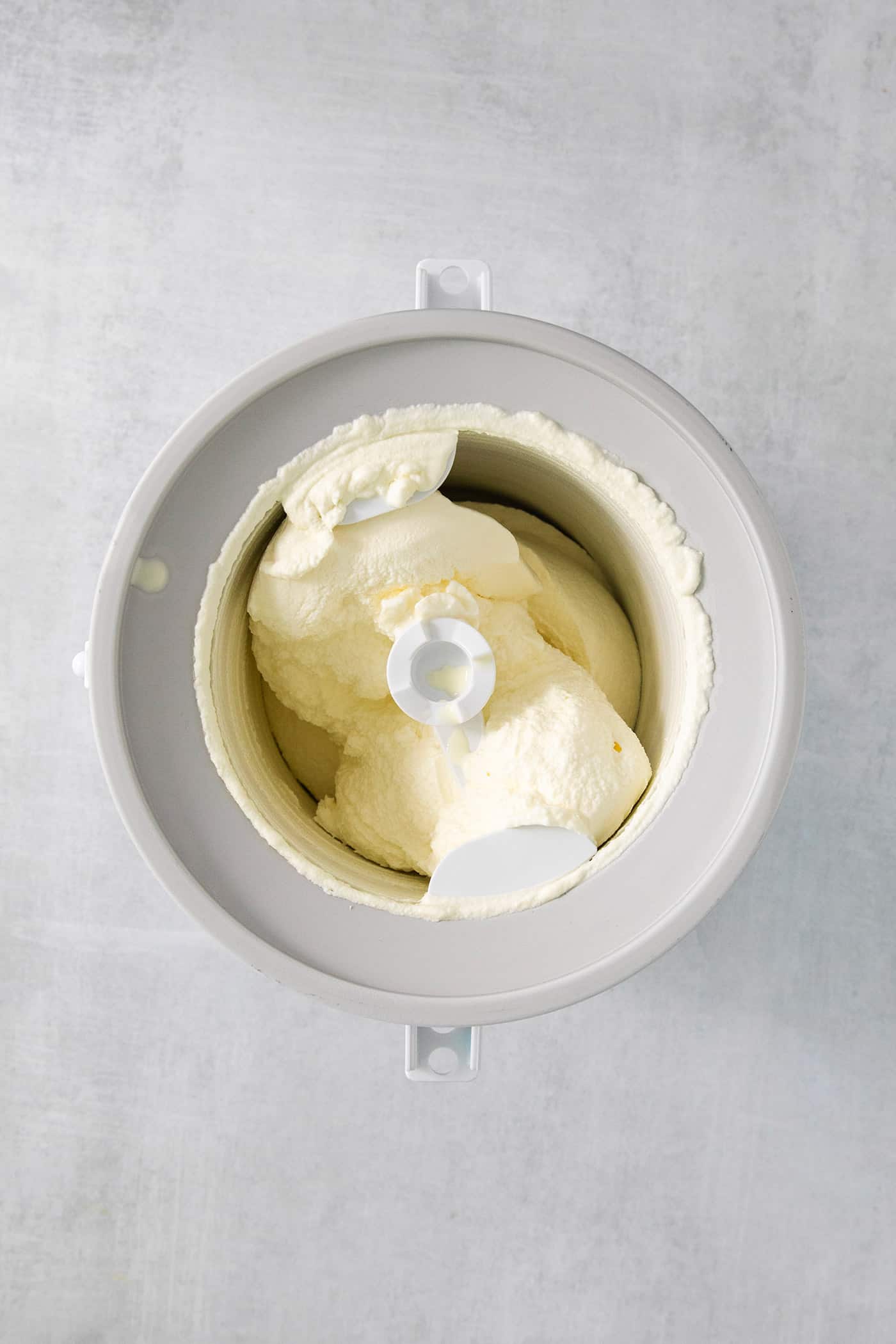 Ice cream base churns in an ice cream maker.