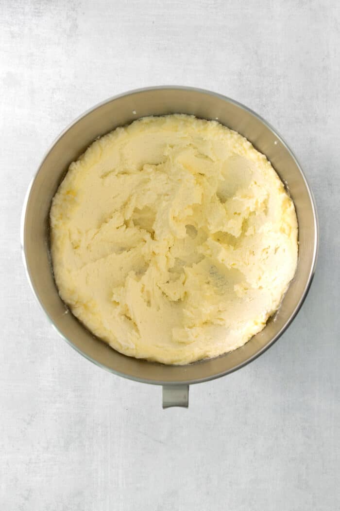 Butter and sugar are creamed in a stand mixer.