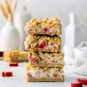 A stack of rhubarb cream cheese bars.