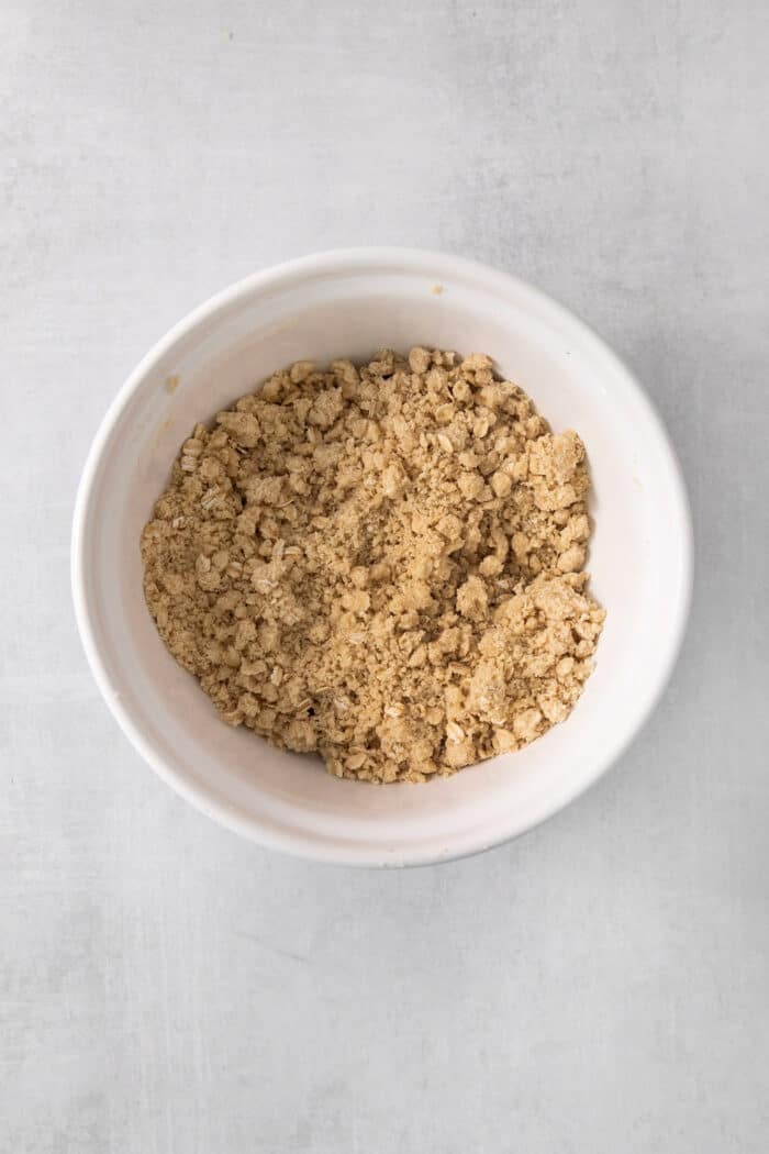 Oat crust in a white bowl.