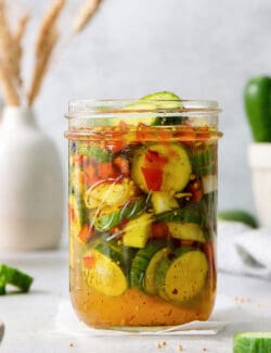 A jar of sweet and spicy pickles.