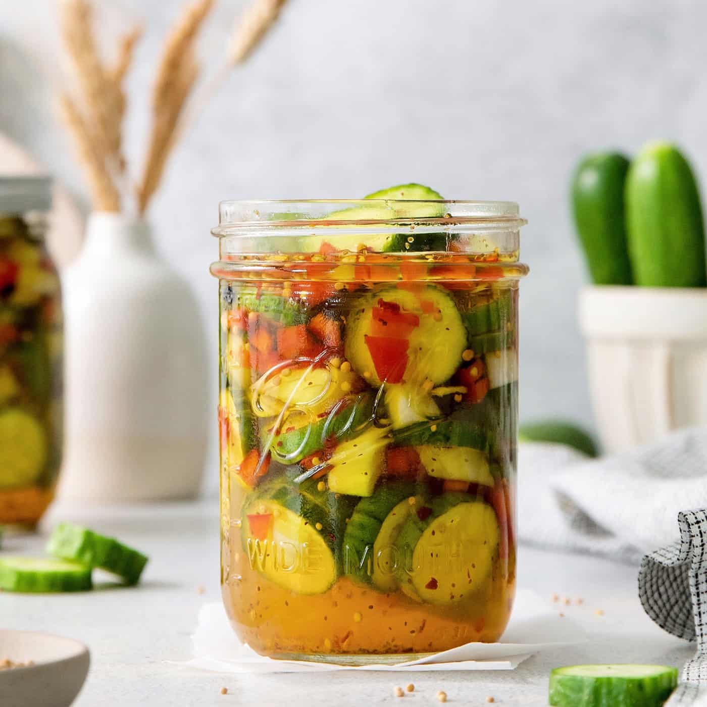 A jar of sweet and spicy pickles.