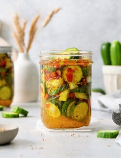 A jar of sweet and spicy pickles.