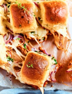 An overhead shot of BBQ chicken sliders.