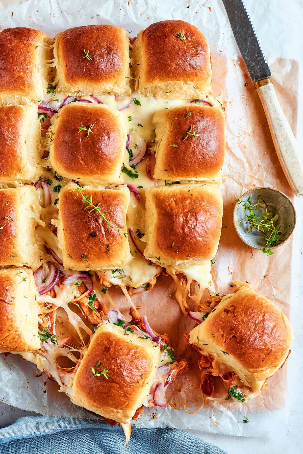 An overhead shot of BBQ chicken sliders.