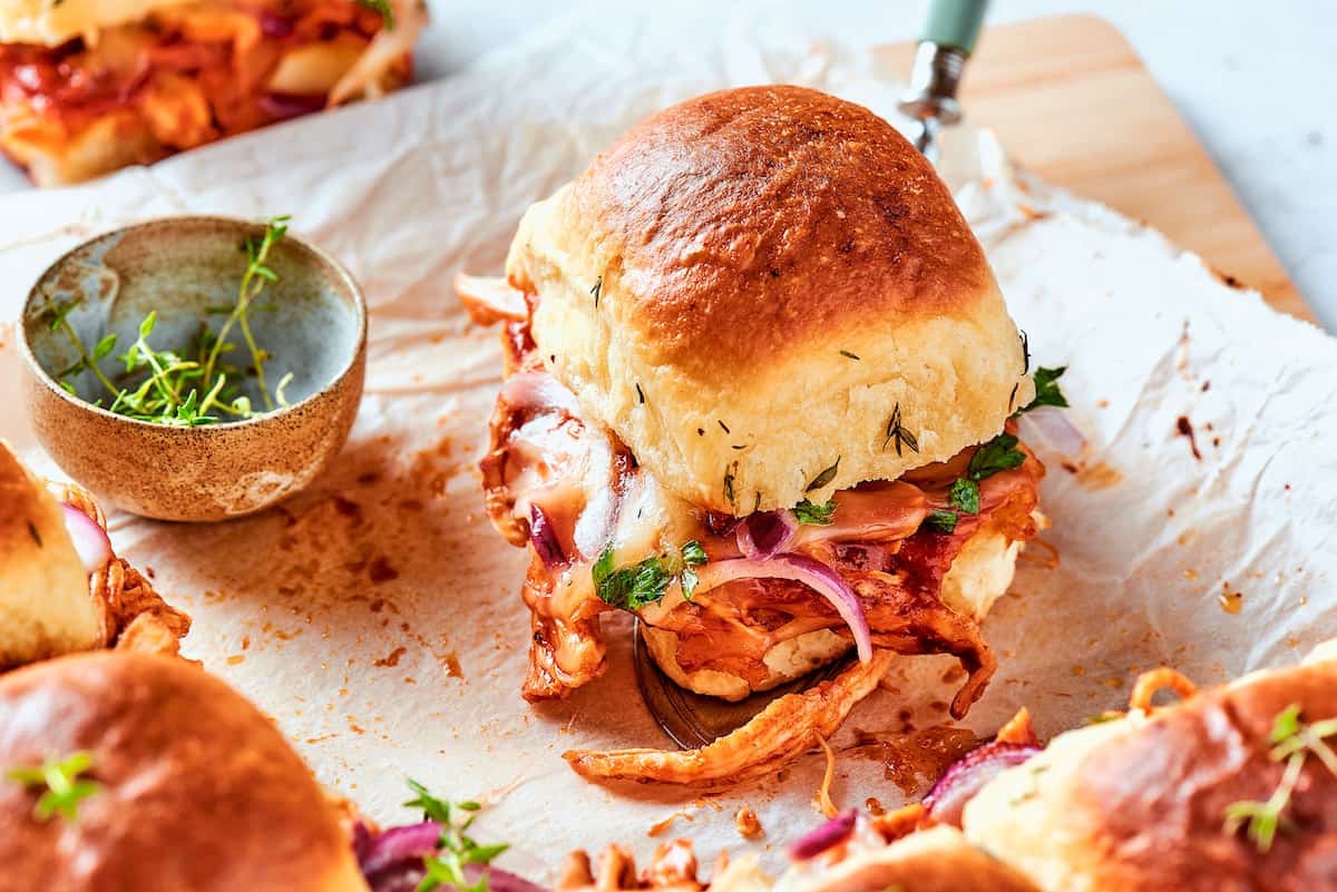 A BBQ chicken sliders on a white background.