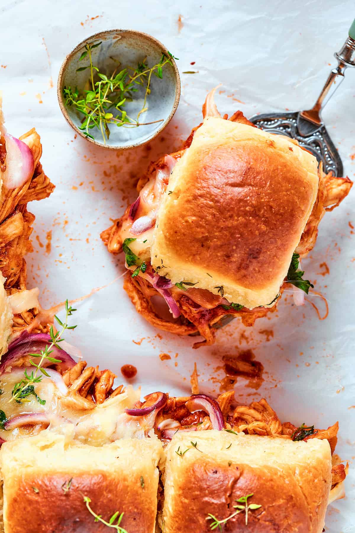 An overhead shot of BBQ chicken sliders.