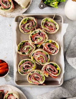 A tray of Italian pinwheel sandwiches.