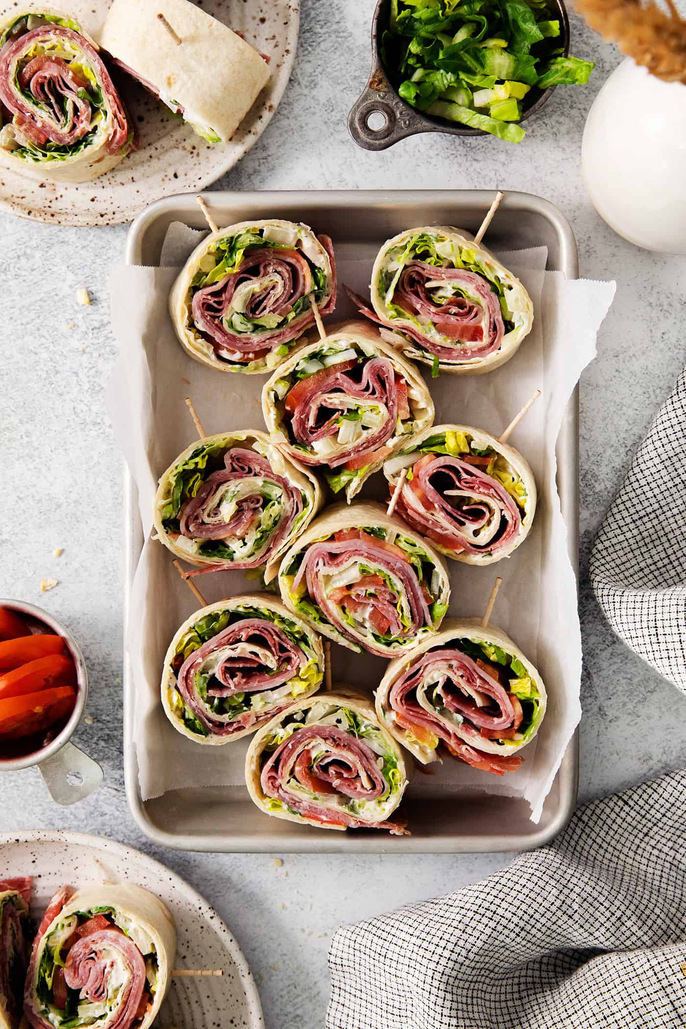 A tray of Italian pinwheel sandwiches.