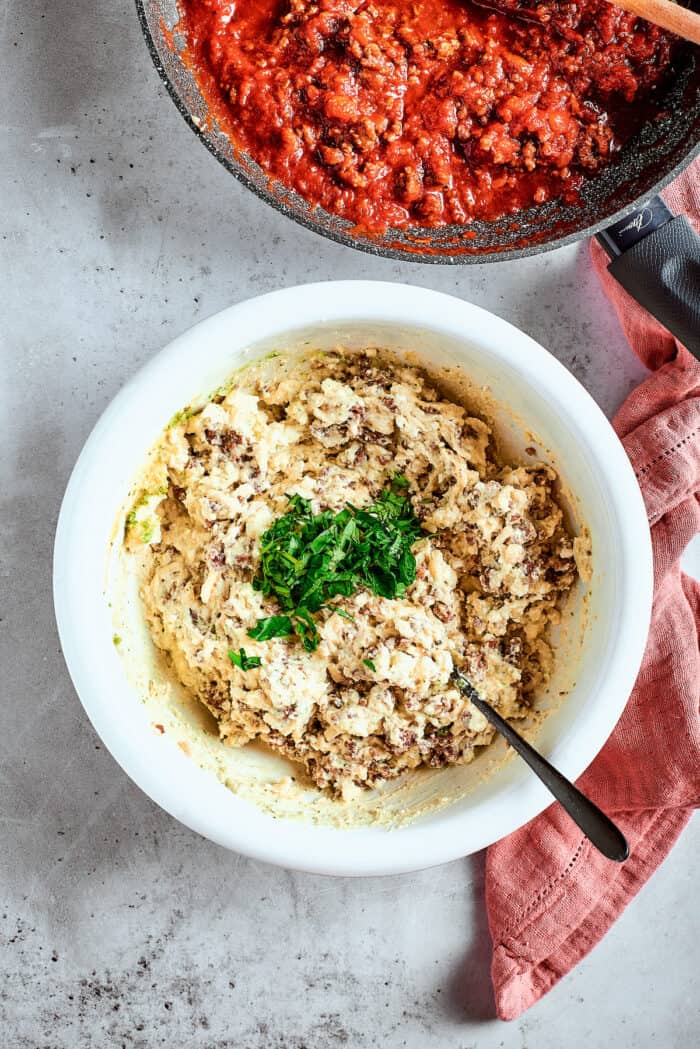 Filling for stuffed shells is shown in a bowl.
