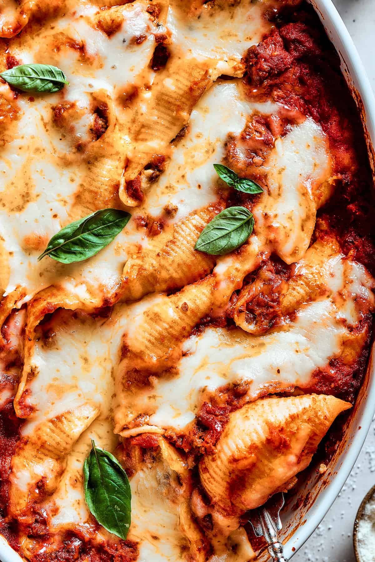 Close up shot of a pan of stuffed shells.