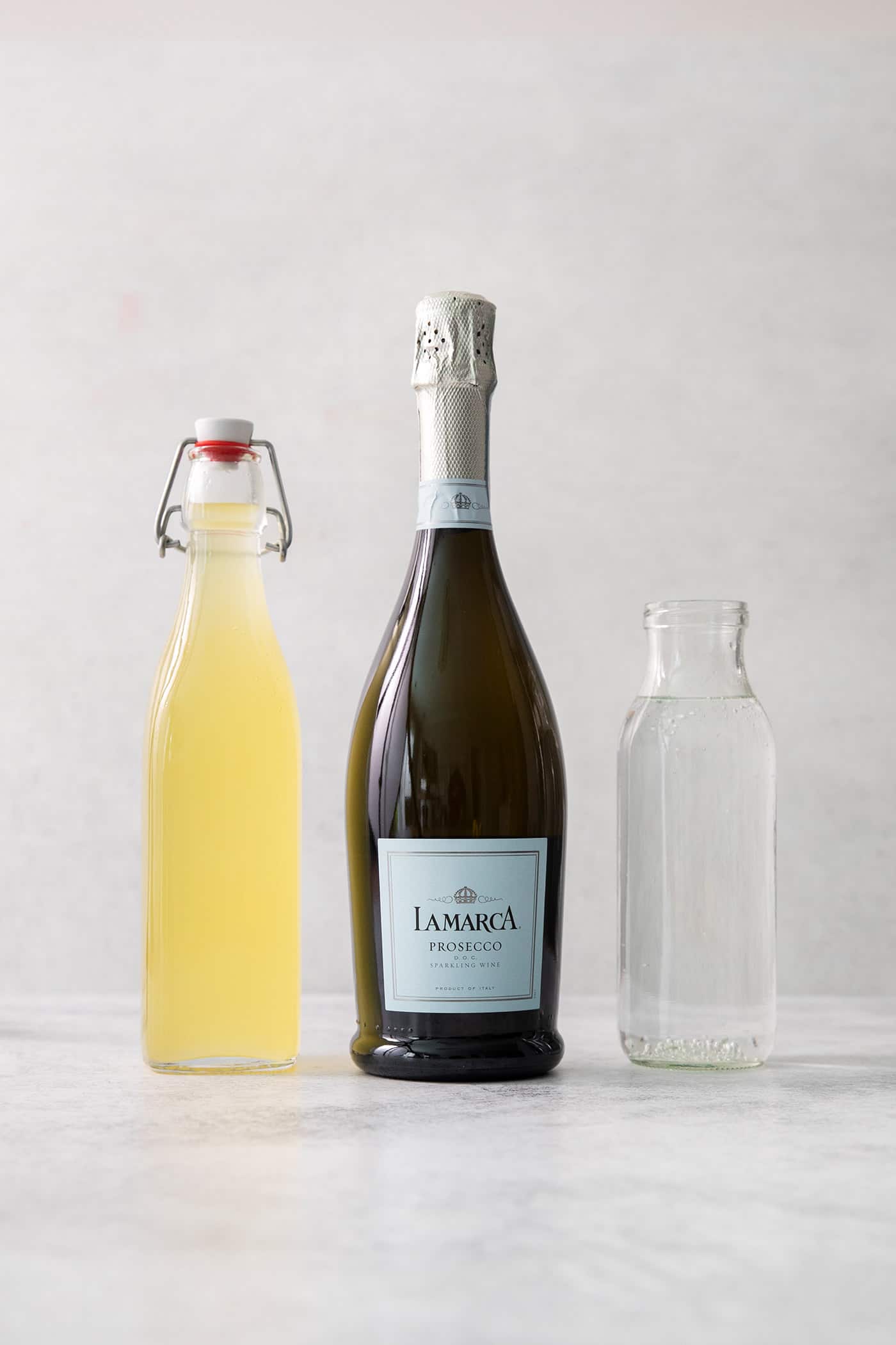 Ingredients for limoncello spritz: limoncello, prosecco, club soda.