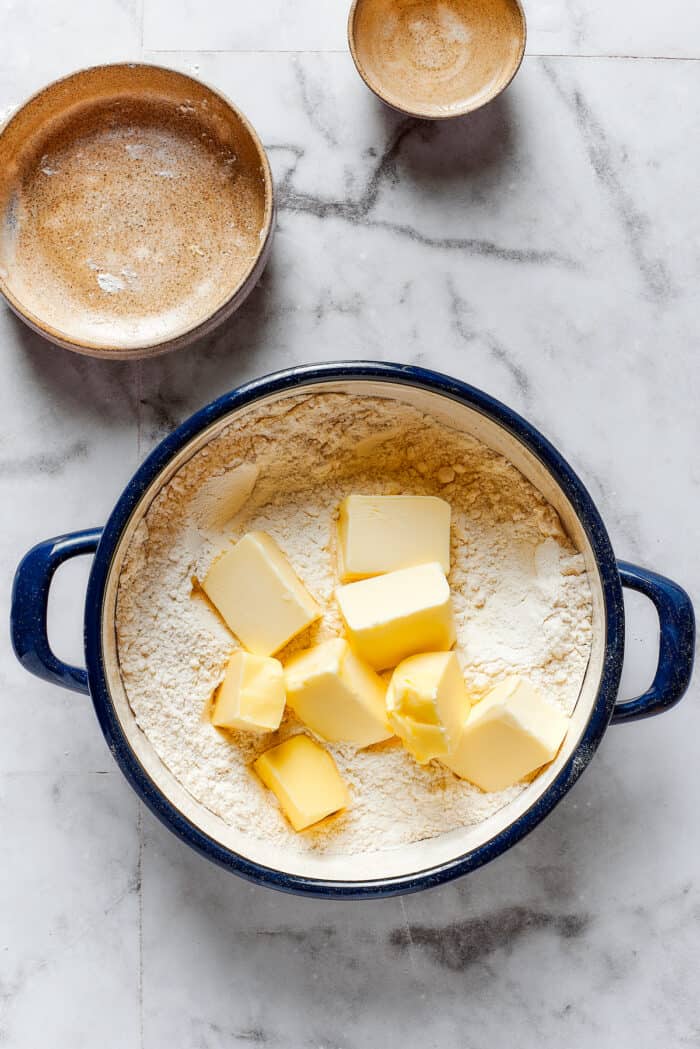 Butter is added to flour for pie crust.